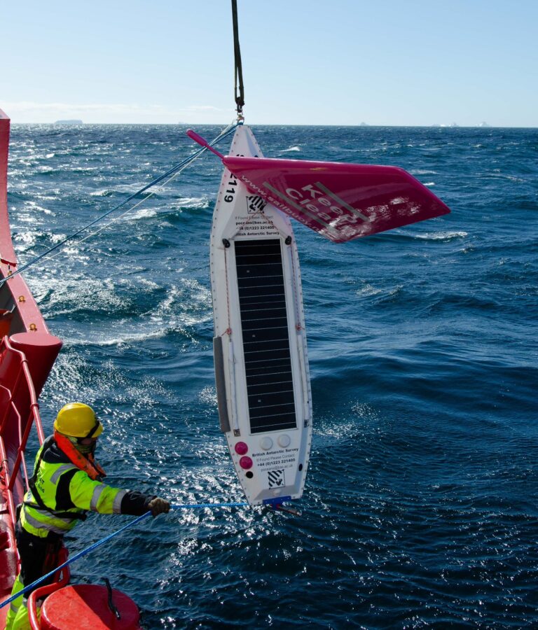 Launching of the BAS Sailbuoy uncrewed surface vehicle off South Georgia. Photo: Carrie Gunn.